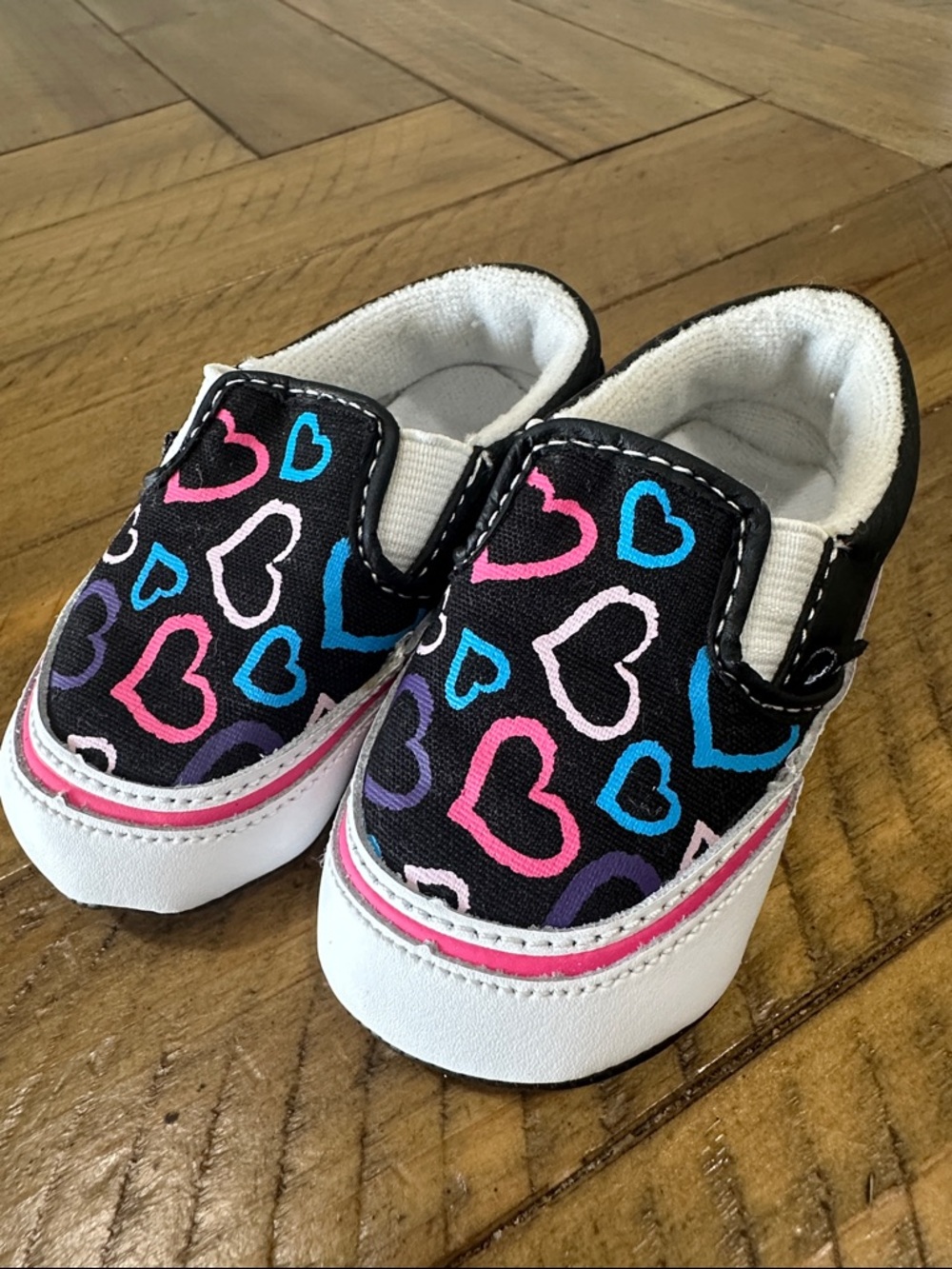 Vans Little Kids Black Slip-Ons with Pink, Blue & Purple Hearts